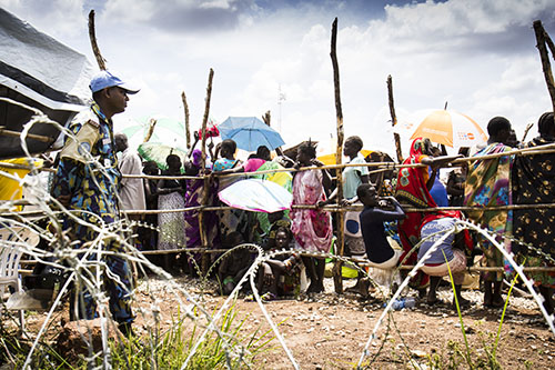 People wait in line to check into a general food distribution in protection of civilian (PoC) site one in UN House, a UN base on the outskirts of Juba where Concern worked with the World Food Programme to distribute food.