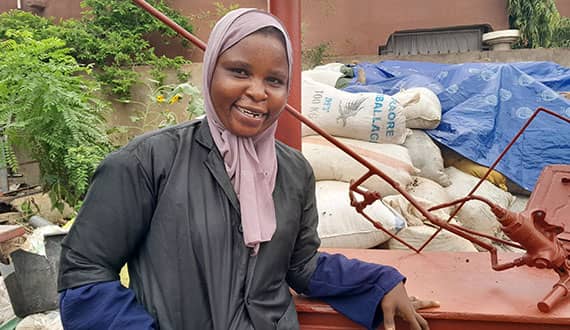 Fatoumata Nikingam (age 29) is pictured with her production equipment for ecofriendly charcoal in the Ségou region of Mali